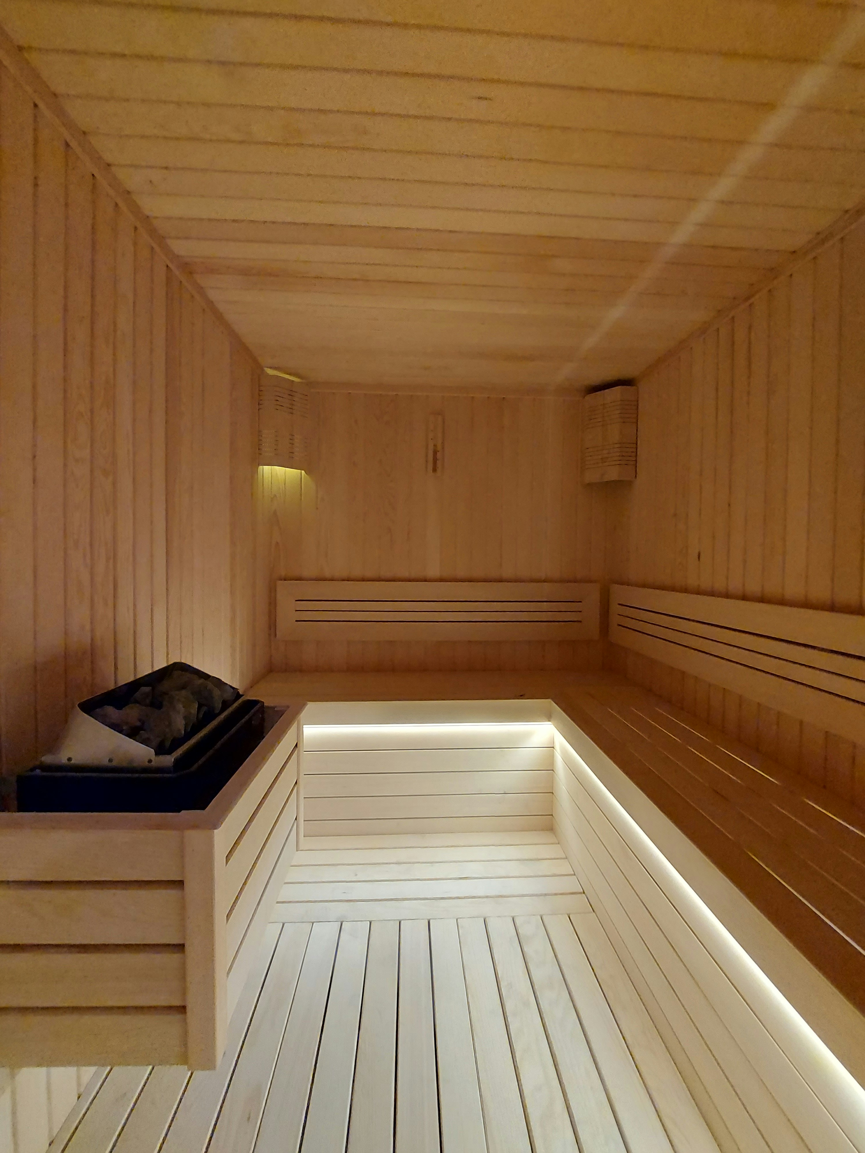Luxury custom sauna interior with LED lighting and premium cedar construction in Bay Area home